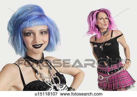 Portrait of happy young and senior female punks against gray background View Large Photo Image Stock Photo - Portrait of happy young and senior female punks against gray background. Fotosearch