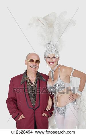Portrait of man with senior showgirl against gray background View Large Photo Image Picture - Portrait of man with senior showgirl against gray background. Fotosearch