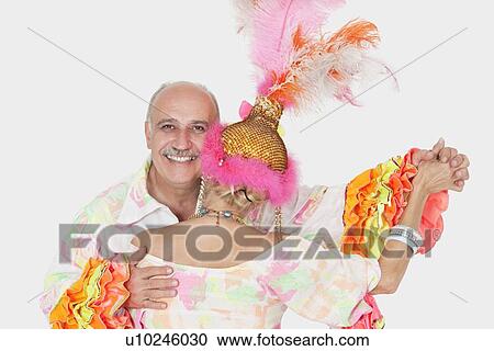 Portrait of senior couple in Brazilian outfits dancing over gray background View Large Photo Image Stock Image - Portrait of senior couple in Brazilian outfits dancing over gray background. Fotosearch