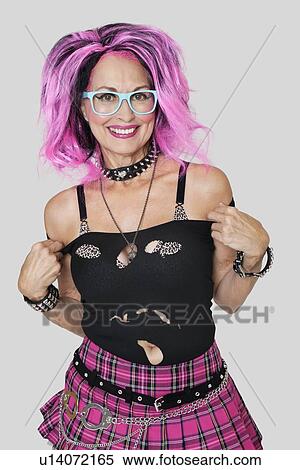 Portrait of senior female punk posing over gray background View Large Photo Image Stock Photography - Portrait of senior female punk posing over gray background. Fotosearch