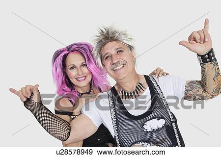 Portrait of senior punk couple over gray background View Large Photo Image Stock Photo - Portrait of senior punk couple over gray background. Fotosearch