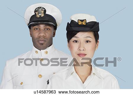 Portrait of two multi-ethnic US Navy officers over light blue background View Large Photo Image Stock Image - Portrait of two multi-ethnic US Navy officers over light blue background. Fotosearch