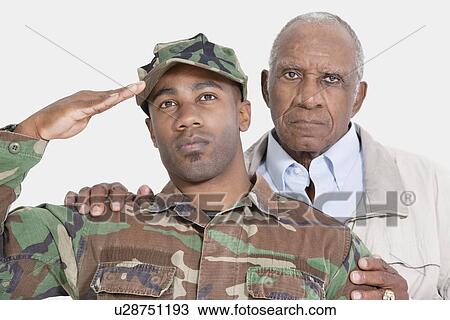 Portrait of US Marine Corps soldier with father saluting over gray background View Large Photo Image Stock Image - Portrait of US Marine Corps soldier with father saluting over gray background. Fotosearch