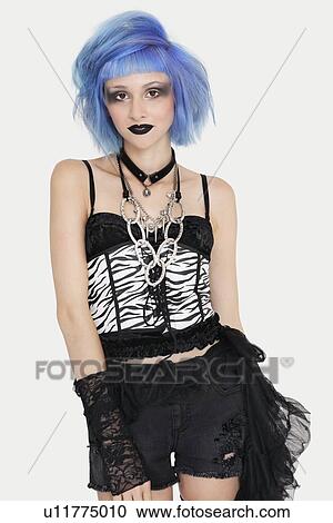 Portrait of young female punk with dyed hair over gray background View Large Photo Image Stock Image - Portrait of young female punk with dyed hair over gray background. Fotosearch