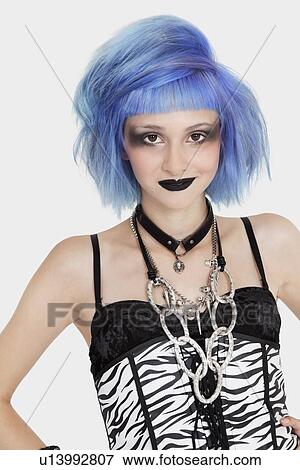 Portrait of young female punk with dyed hair over gray background View Large Photo Image Stock Photo - Portrait of young female punk with dyed hair over gray background. Fotosearch