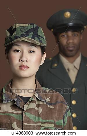 Portrait of young female US Marine Corps soldier with officer in the background View Large Photo Image Stock Image - Portrait of young female US Marine Corps soldier with officer in the background. Fotosearch