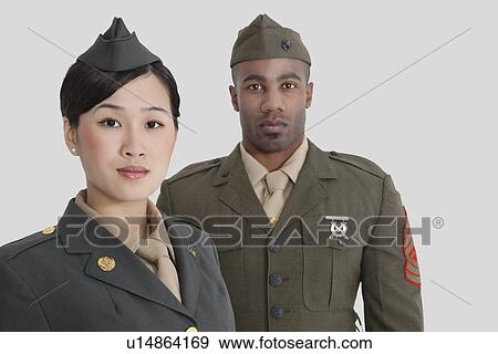 Portrait of young US military officers in uniform over gray background View Large Photo Image Stock Photo - Portrait of young US military officers in uniform over gray background. Fotosearch