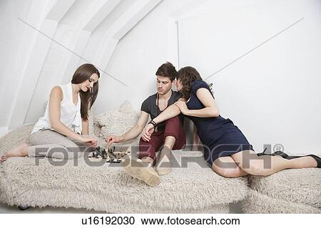 Three young friends have a leisure time View Large Photo Image Stock Image - Three young friends have a leisure time. Fotosearch