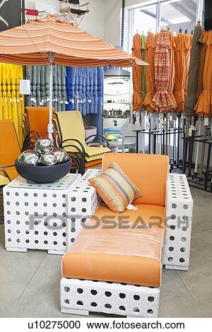 Variety of patio umbrellas and seating furniture in garden furniture store View Large Photo Image Stock Image - Variety of patio umbrellas and seating furniture in garden furniture store. Fotosearch