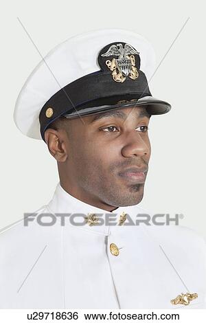 Young African American US Navy officer over gray background View Large Photo Image Stock Photograph - Young African American US Navy officer over gray background. Fotosearch