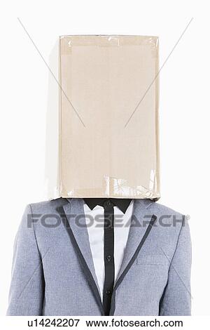 Young boy wearing jacket with box covered over his face on gray background View Large Photo Image Stock Photo - Young boy wearing jacket with box covered over his face on gray background. Fotosearch