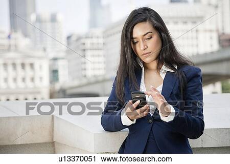 Young Indian businesswoman using smart phone View Large Photo Image Stock Image - Young Indian businesswoman using smart phone. Fotosearch