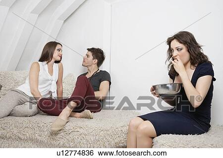 Young woman watching couple have quality time together View Large Photo Image Stock Photograph - Young woman watching couple have quality time together. Fotosearch