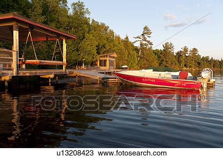 Boats at a dock, Lake of the Woods, Ontario, Canada View Large Photo Image Stock Image - Boats at a dock, Lake of the Woods, Ontario, Canada. Fotosearch