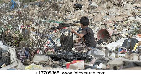 Boy collecting recyclable items from dump yard, Zona 3, Guatemala City, Guatemala View Large Photo Image Stock Photography - Boy collecting recyclable items from dump yard, Zona 3, Guatemala City, Guatemala. Fotosearch