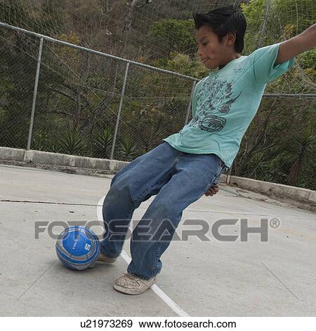 Boy playing with a soccer ball, Colonia Bethania, Guatemala City, Guatemala View Large Photo Image Stock Photo - Boy playing with a soccer ball, Colonia Bethania, Guatemala City, Guatemala. Fotosearch
