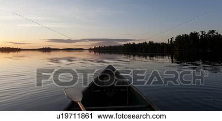 Canoe in a lake, Lake of the Woods, Ontario, Canada View Large Photo Image Stock Image - Canoe in a lake, Lake of the Woods, Ontario, Canada. Fotosearch