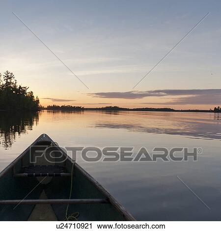 Canoe in a lake, Lake of the Woods, Ontario, Canada View Large Photo Image Stock Image - Canoe in a lake, Lake of the Woods, Ontario, Canada. Fotosearch