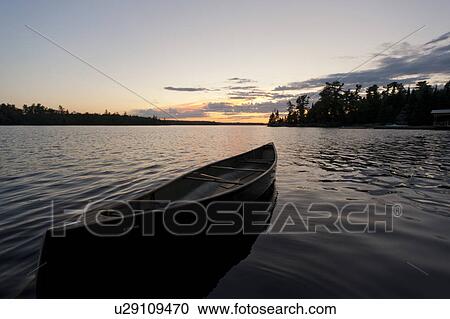 Canoe in a lake, Lake of the Woods, Ontario, Canada View Large Photo Image Stock Image - Canoe in a lake, Lake of the Woods, Ontario, Canada. Fotosearch