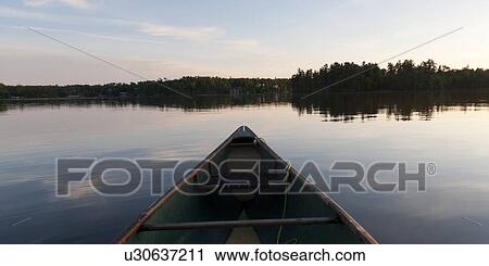 Canoe in a lake, Lake of the Woods, Ontario, Canada View Large Photo Image Stock Image - Canoe in a lake, Lake of the Woods, Ontario, Canada. Fotosearch