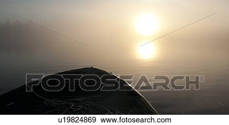 Stock Photo - Canoe in a lake, Lake of the Woods, Ontario, Canada. Fotosearch