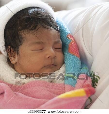 Stock Photo - Close-up of a baby sleeping, Colonia Bethania, Guatemala City, Guatemala. Fotosearch
