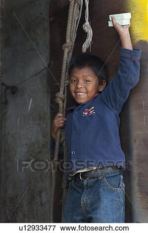 Close-up of a boy holding soap bars and smiling, Colonia Landivar, Guatemala City, Guatemala View Large Photo Image Stock Photo - Close-up of a boy holding soap bars and smiling, Colonia Landivar, Guatemala City, Guatemala. Fotosearch