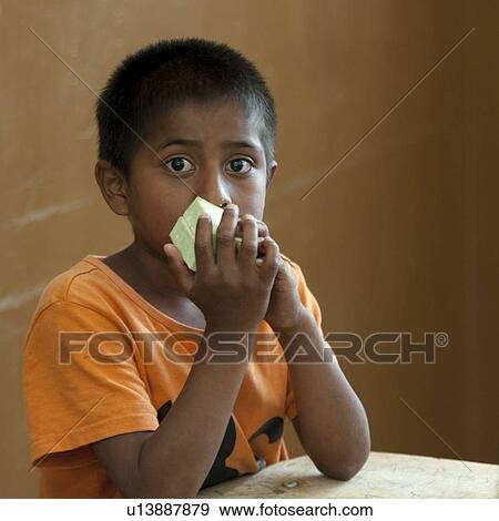 Close-up of a boy smelling soap bars, San Jose Pinula, Department of Guatemala, Guatemala View Large Photo Image Stock Photo - Close-up of a boy smelling soap bars, San Jose Pinula, Department of Guatemala, Guatemala. Fotosearch