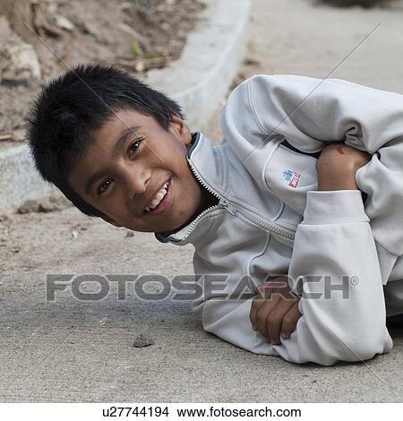 Close-up of a boy smiling, Colonia Bethania, Guatemala City, Guatemala View Large Photo Image Picture - Close-up of a boy smiling, Colonia Bethania, Guatemala City, Guatemala. Fotosearch