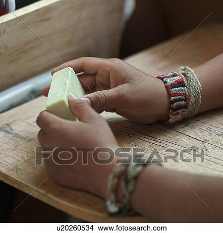 Picture - Close-up of a child's hands holding a soap bar, San Jose Pinula, Guatemala City, Guatemala. Fotosearch