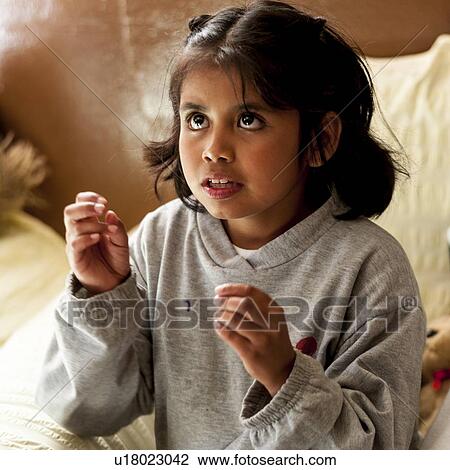 Stock Image - Close-up of a girl, San Jose Pinula, Department of Guatemala, Guatemala. Fotosearch