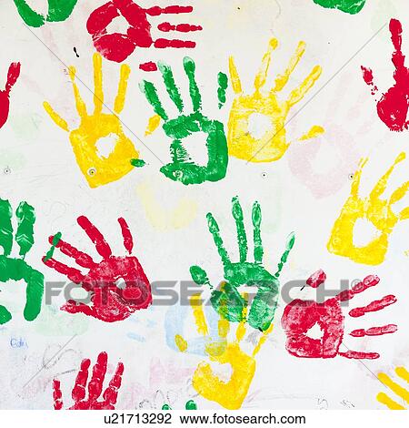 Stock Image - Close-up of colorful hand prints on a wall, Guatemala City, Guatemala. Fotosearch