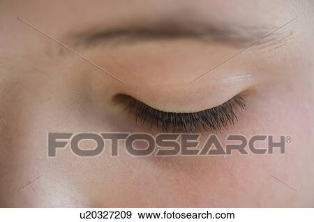Close-up of the closed eye of a girl View Large Photo Image Stock Photo - Close-up of the closed eye of a girl. Fotosearch
