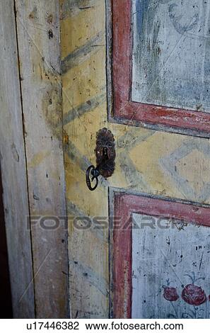 Stock Image - Closed door with key, Lake of the Woods, Ontario, Canada. Fotosearch