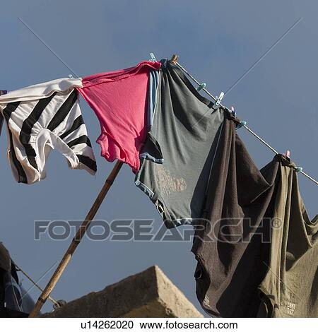 Stock Image - Clothes drying on a clothesline, Colonia Bethania, Guatemala City, Guatemala. Fotosearch