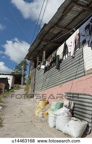 Stock Photo - Clothes drying outside a house in a slum area, Colonia Bethania, Guatemala City, Guatemala. Fotosearch