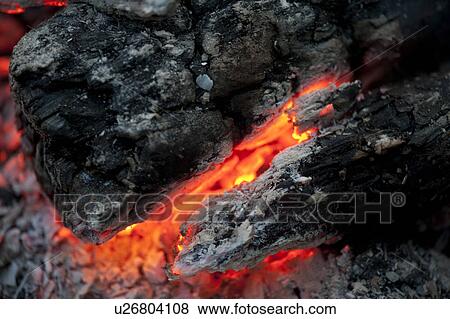 Stock Photo - Flame and hot coals, Lake of the Woods, Ontario, Canada. Fotosearch