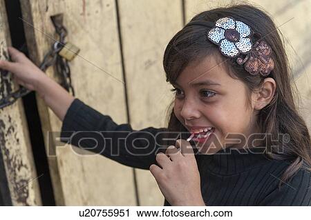 Girl eating a lollipop, Colonia Landivar, Guatemala City, Guatemala View Large Photo Image Stock Image - Girl eating a lollipop, Colonia Landivar, Guatemala City, Guatemala. Fotosearch