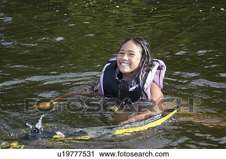 Girl swimming in a lake, Lake of the Woods, Ontario, Canada View Large Photo Image Stock Image - Girl swimming in a lake, Lake of the Woods, Ontario, Canada. Fotosearch
