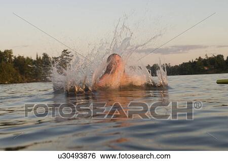Girl swimming in a lake, Lake of the Woods, Ontario, Canada View Large Photo Image Stock Photograph - Girl swimming in a lake, Lake of the Woods, Ontario, Canada. Fotosearch