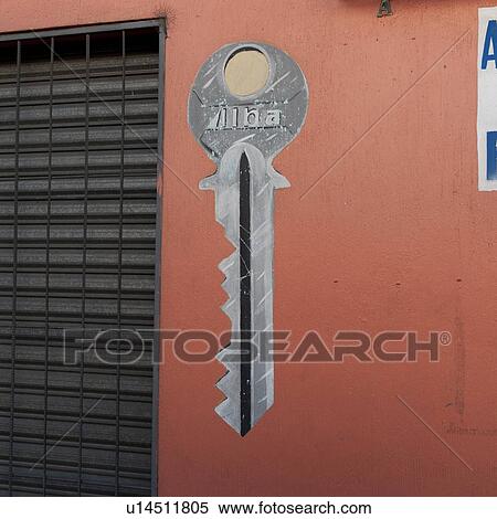 Stock Photography - Key sign painted on the wall of a store, Zona 1, Guatemala City, Guatemala. Fotosearch