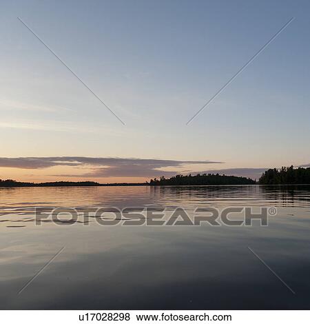 Lake at dusk, Lake of the Woods, Ontario View Large Photo Image Stock Photo - Lake at dusk, Lake of the Woods, Ontario. Fotosearch