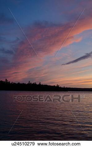 Stock Photo - Lake at dusk, Lake of the Woods, Ontario, Canada. Fotosearch