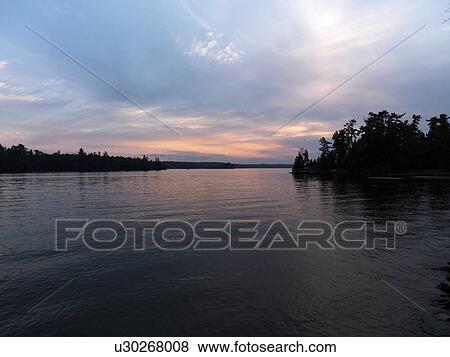 Stock Photo - Lake at dusk, Lake of the Woods, Ontario, Canada. Fotosearch