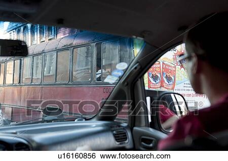 Man driving a car, Zona 1, Guatemala City, Guatemala View Large Photo Image Stock Photograph - Man driving a car, Zona 1, Guatemala City, Guatemala. Fotosearch