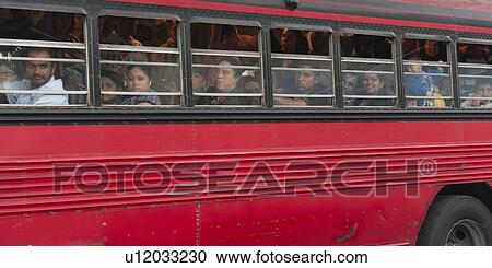 Stock Image - Passengers traveling in a bus, Zona 1, Guatemala City, Guatemala. Fotosearch