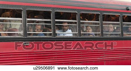 Stock Image - Passengers traveling in a bus, Zona 1, Guatemala City, Guatemala. Fotosearch
