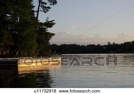 Stock Photo - Pier in a lake, Lake of the Woods, Ontario, Canada. Fotosearch