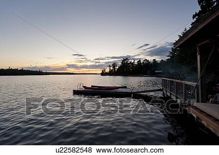 Stock Photo - Pier in a lake, Lake of the Woods, Ontario, Canada. Fotosearch