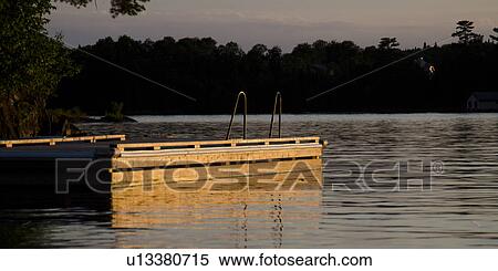 Stock Photography - Pier in a lake, Lake of the Woods, Ontario, Canada. Fotosearch